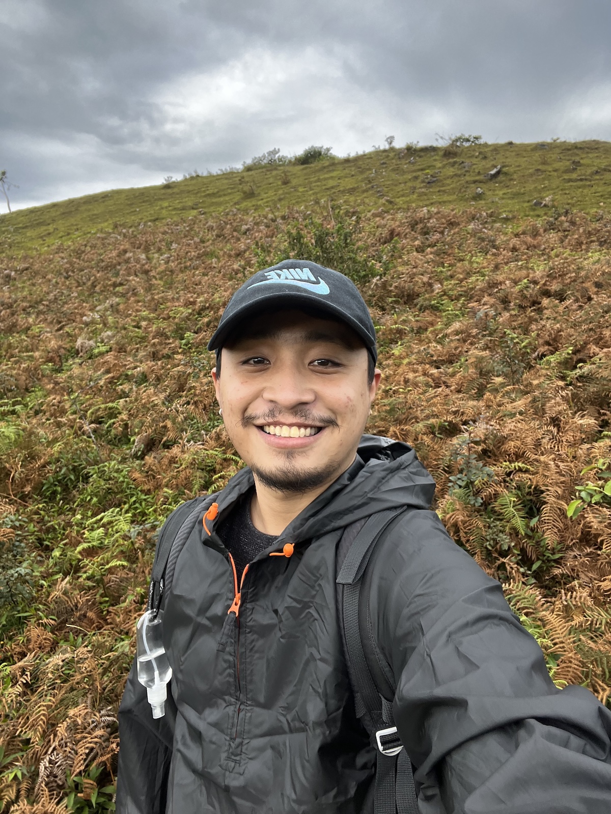 Markley Dylen Albano hiking on a mountain trail — Filipino digital nomad